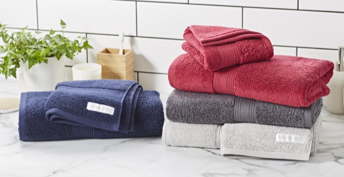 Folded grey, red and dark steel blue towels